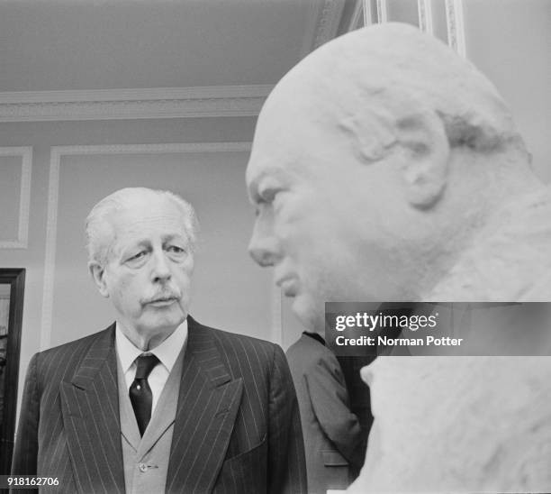 British Conservative Party politician and former Prime Minister of the United Kingdom Harold Macmillan near Winston Churchill bust, unveiled at the...