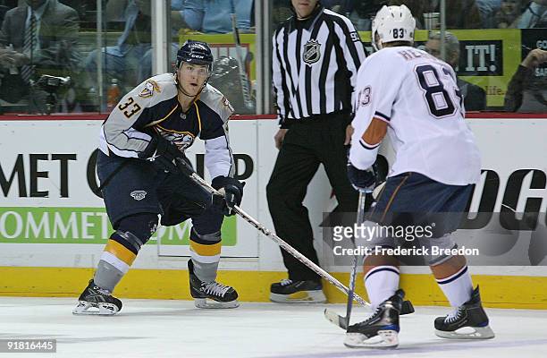 Center Colin Wilson of the Nashville Predators, appearing in his first career NHL game, skates against right wing Ales Hemsky of the Edmonton Oilers...