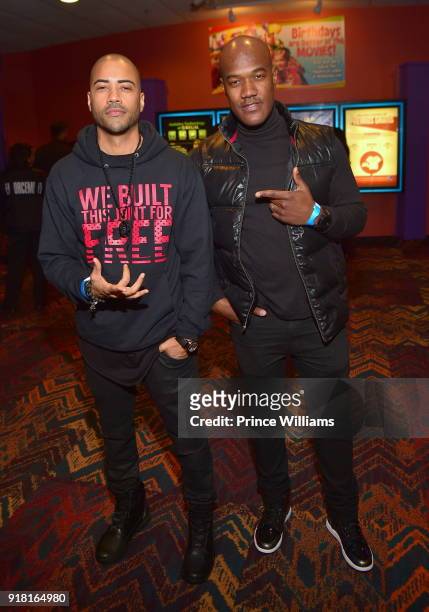 Brad James and Errol Saddler attend "Black Panther" Advance Screeing at Regal Hollywood on February 13, 2018 in Chamblee, Georgia.