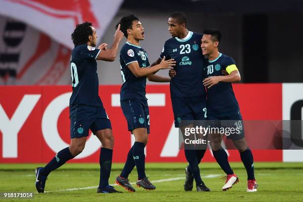 Buriram United players Diogo Luis Santo , Ratthanakorn Maikami , Edgar and Jakkaphan Kaewprom celebrate a goal during their AFC Champions League...