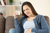 Woman suffering lactose intolerance