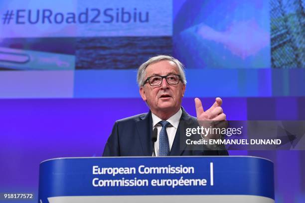 European Commission President Jean-Claude Juncker gestures as he delivers a speech during a press conference at the European Commission in Brussels...