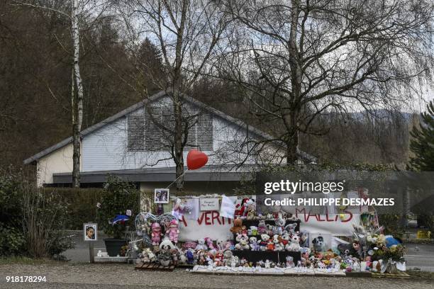 Banner covered with stuff toys is seen, on February 14 in Le Pont-de-Beauvoisin, at the place where eight-year-old girl Maelys de Araujo was seen for...