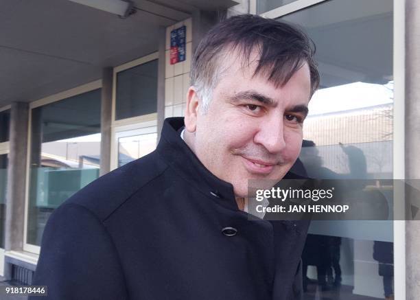 Former Georgian president Mikheil Saakashvili looks on as he stands in front of the Immigration and Naturalisation offices in Rotterdam on february...