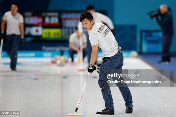 Yusuke Morozumi, Tsuyoshi Yamaguchi and Kosuke Morozumi of Japan compete in the Curling Men's Round Robin Session 1 held at Gangneung Curling Centre...