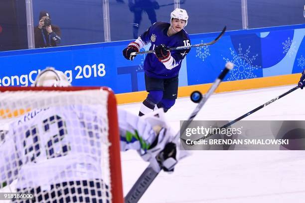 S Ryan Donato takes a shot during the final period of the men's preliminary round ice hockey match between the United States and Slovenia during the...