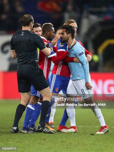 Serey Die of FC Basel and Ilkay Gundogan of Manchester City have a disagreement during the UEFA Champions League Round of 16 First Leg match between...