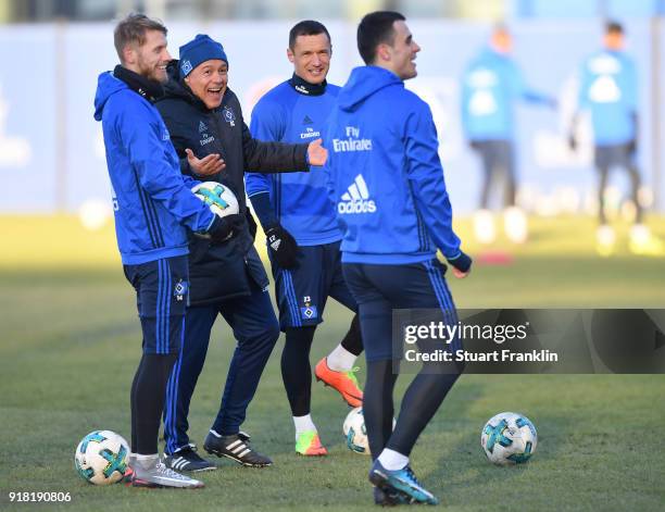 Rodolfo Cardoso, assistant coach of Hamburg jokes with Aaron Hunt, Sejad Salihovic and Filip Kostic during a training session of Hamburger SV at...