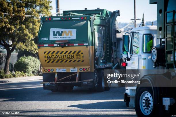 Waste Management Inc. Garbage collection trucks leave the company's Davis Street Recycling & Transfer Station in San Leandro, California, U.S., on...