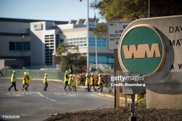 Waste Management Inc. Signage stands on display outside the company's Davis Street Recycling & Transfer Station in San Leandro, California, U.S., on...