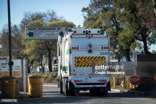 Waste Management Inc. Garbage collection truck enters the company's Davis Street Recycling & Transfer Station in San Leandro, California, U.S., on...
