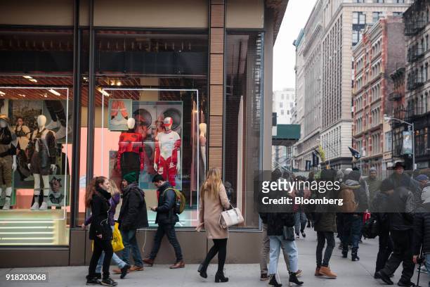 Pedestrians pass in front of a Nike Inc. Store in the SoHo neighborhood of New York, U.S., on Friday, Feb. 9, 2018. Bloomberg is scheduled to release...