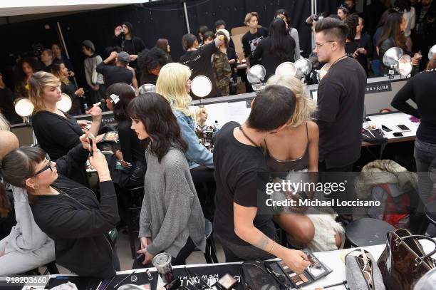 Model prepares backstage for Laquan Smith during New York Fashion Week: The Shows at Gallery I at Spring Studios on February 14, 2018 in New York...