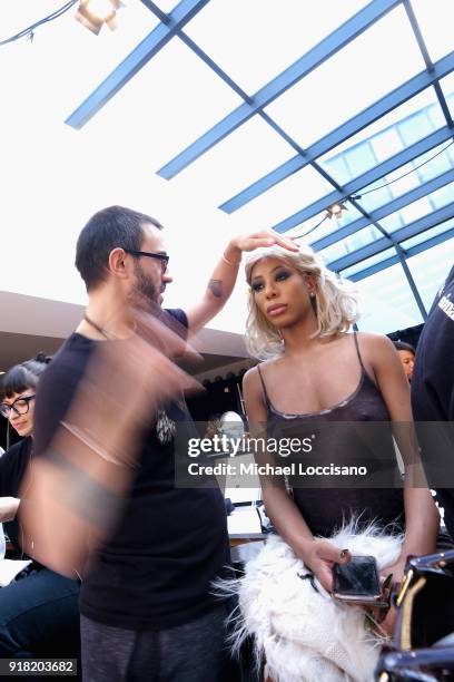 Model prepares backstage for Laquan Smith during New York Fashion Week: The Shows at Gallery I at Spring Studios on February 14, 2018 in New York...