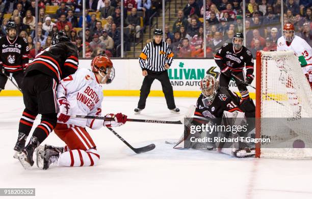 Cayden Primeau of the Northeastern Huskies makes a save against the Boston University Terriers during NCAA hockey in the championship game of the...