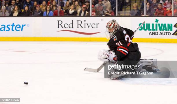 Cayden Primeau of the Northeastern Huskies makes a save against the Boston University Terriers during NCAA hockey in the championship game of the...