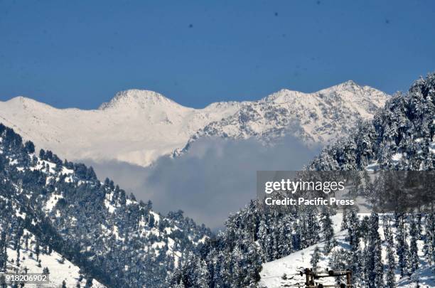 Snow shrouds the village of Daksum, about 97 kilometers south of Srinagar city, the summer capital of Indian-controlled Kashmir, Feb. 14, 2018. The...