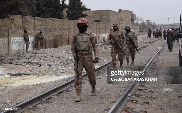 Pakistani paramilitary soldiers patrol near the site of an attack by gunmen on policemen in Quetta on February 14, 2018. Gunmen on February 14 killed...