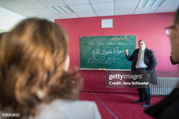 Abdassamad El Yazidi , Secretary General of the Central Council of Muslims, reacts in the Muslim cultural center and mosque as Aydan Ozoguz , German...