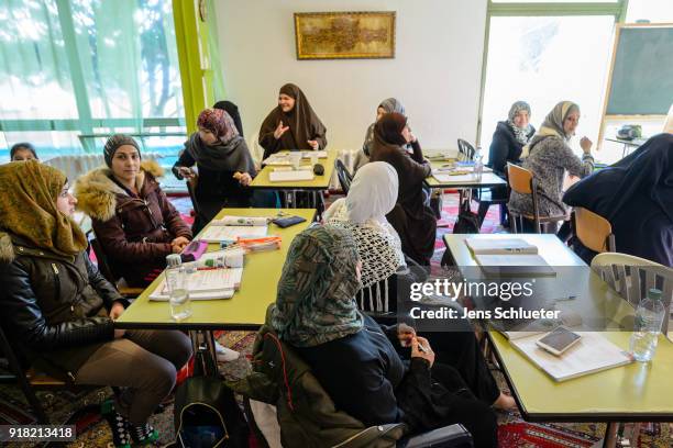 Muslim women from Syria take part in a German lesson in the Muslim cultural center and mosque as Aydan Ozoguz , German Federal Commissioner for...