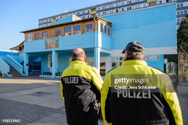 Two policemen secure the Muslim cultural center and mosque following a recent attack just before the beginning of the visit of Aydan Ozoguz , German...