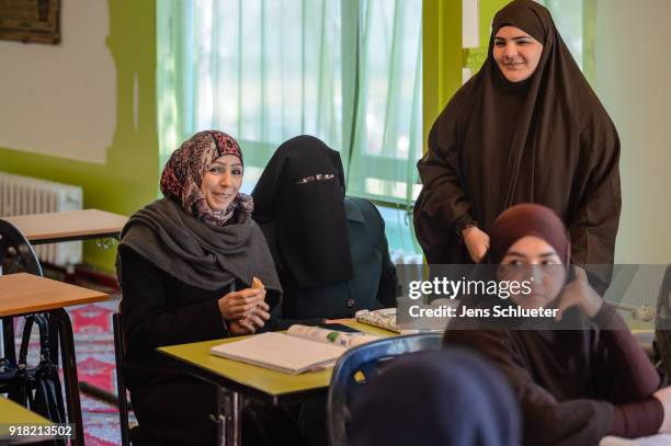 Muslim women from Syria take part in a German lesson in the Muslim cultural center and mosque as Aydan Ozoguz , German Federal Commissioner for...