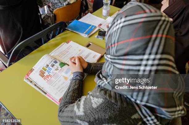 Muslim woman from Syria takes part in a German lesson in the Muslim cultural center and mosque as Aydan Ozoguz , German Federal Commissioner for...