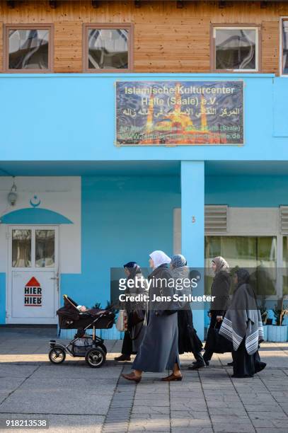Muslim women walk along the Muslim cultural center and mosque following a recent attack just before the beginning of the visit of Aydan Ozoguz ,...