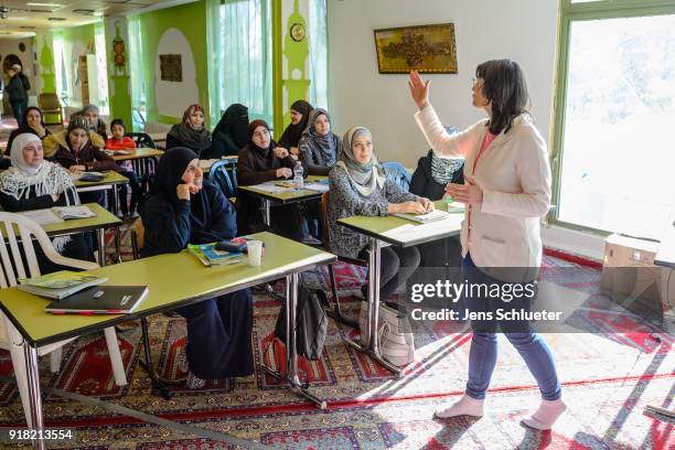 Muslim women from Syria take part in a German lesson in the Muslim cultural center and mosque as Aydan Ozoguz , German Federal Commissioner for...