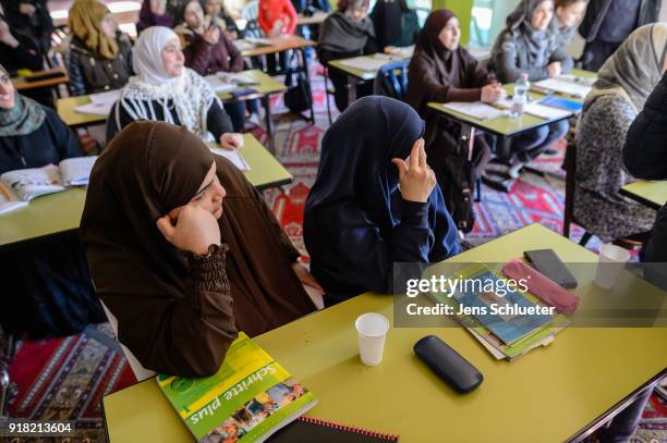 Muslim women from Syria take part in a German lesson in the Muslim cultural center and mosque as Aydan Ozoguz , German Federal Commissioner for...