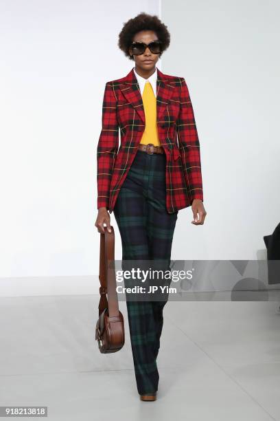 Model walks the runway during the Michael Kors Collection Fall 2018 Runway Show at Vivian Beaumont Theatre at Lincoln Center on February 14, 2018 in...