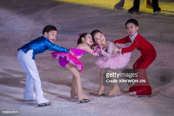Child skaters perform during the opening ceremony of a figure skating festival marking the anniversary of the birth of late North Korean leader Kim...