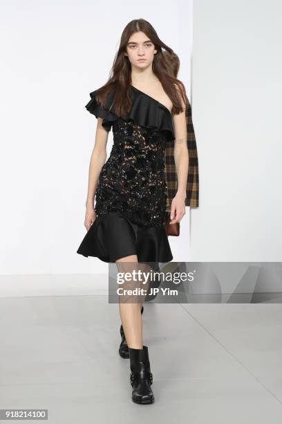 Model walks the runway during the Michael Kors Collection Fall 2018 Runway Show at Vivian Beaumont Theatre at Lincoln Center on February 14, 2018 in...