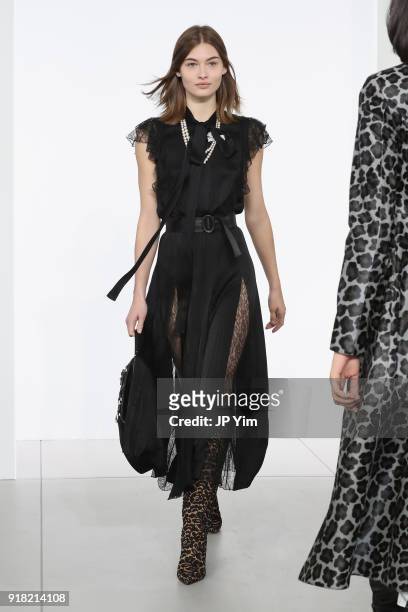 Model walks the runway during the Michael Kors Collection Fall 2018 Runway Show at Vivian Beaumont Theatre at Lincoln Center on February 14, 2018 in...