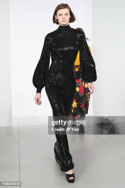 Model walks the runway during the Michael Kors Collection Fall 2018 Runway Show at Vivian Beaumont Theatre at Lincoln Center on February 14, 2018 in...