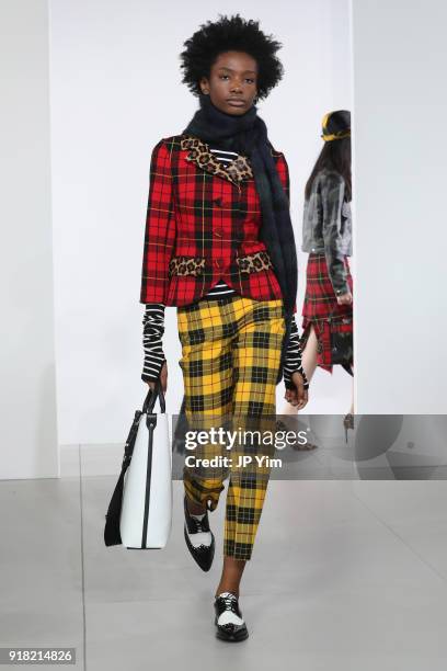 Model walks the runway during the Michael Kors Collection Fall 2018 Runway Show at Vivian Beaumont Theatre at Lincoln Center on February 14, 2018 in...