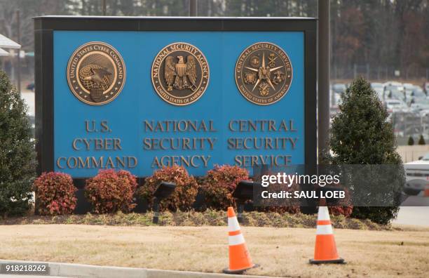 Sign for the National Security Agency , US Cyber Command and Central Security Service, is seen near the visitor's entrance to the headquarters of the...