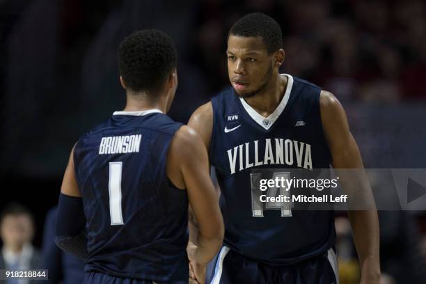 Jalen Brunson of the Villanova Wildcats talks to Omari Spellman against the Temple Owls at the Liacouras Center on December 13, 2017 in Philadelphia,...