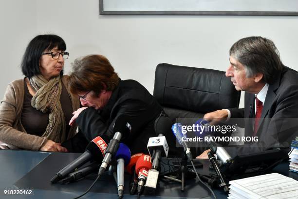 Lawyer Etienne Nicolau , tens to Conception Gonzalez who reacts in tears, as Marie-Jose Garcia looks on, the mothers of Marie-Helene Gonzales and...