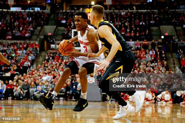 Jackson of the Ohio State Buckeyes drives the ball against Jordan Bohannon of the Iowa Hawkeyes during the game at Value City Arena on February 10,...