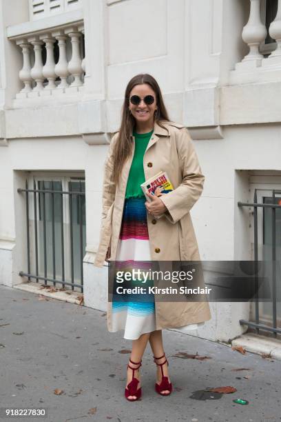 Founder of The Webster store and fashion buyer Laure Heriard Dubreuil wears a Celine coat, Valentino dress and sunglasses and Charlotte Olympia bag...