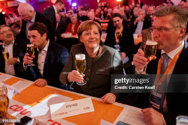 German Chancellor and leader of the German Christian Democrats Angela Merkel cheers to supporters upon her arrival at the CDU political Ash Wednesday...