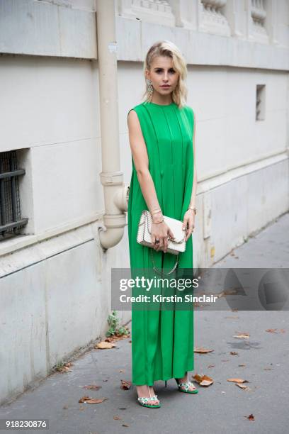 Fashion influencer Caroline Daur wears a Valentino dress, bag and shoes and a Burberry earring day 6 of Paris Womens Fashion Week Spring/Summer 2018,...