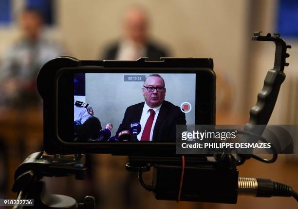French State Prosecutor of Grenoble Jean-Yves Coquillat is seen through a monitor as he gives a press conference about a former soldier investigated...