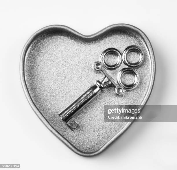 close-up of key and heart on white background - diary lock stock pictures, royalty-free photos & images