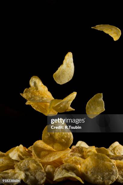 potato chips dropping - falling salt stock pictures, royalty-free photos & images