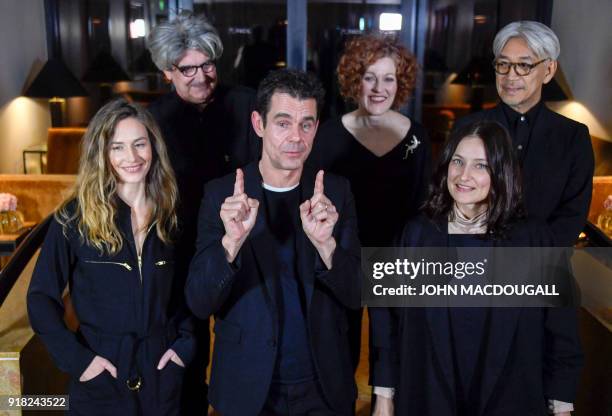 The president of the jury for the 68th Berlinale film festival German director Tom Tykwer poses with the members of the jury, Belgian actress Cecile...