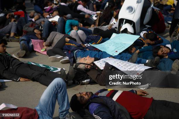 Nepalese youth and students demonstrate as they participate in campaign Maskmandu against the increasing air pollution in Kathmandu, Nepal, February...