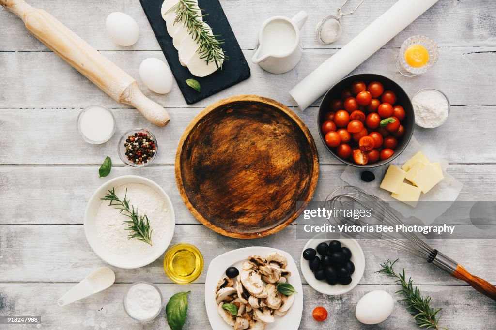 Baking preparation background. Freshly baked pizza. Cooking process, Italian food concept