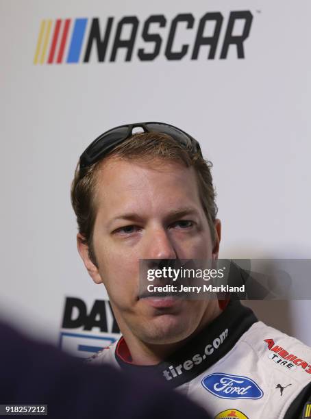 Brad Keselowski, driver of the Discount Tire Ford, speaks with the media during the Daytona 500 Media Day at Daytona International Speedway on...